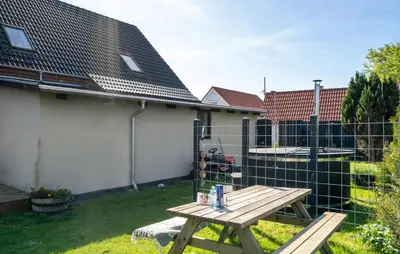 a picnic table in the backyard of a house at Det gamle forsamlinghus in Struer