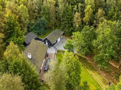 an overhead view of a house in the woods at Holiday Home Vicente - 14km to the fjord by Interhome in Års