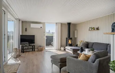 a living room with a couch and a tv at Cozy Home In Lemvig With Wifi in Lemvig