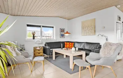 a living room with a couch and chairs and a table at Lovely Home In Blokhus With Wifi in Blokhus