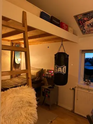 a bedroom with a bunk bed with a bag hanging from it at En SMUK og CHARMERENDE OASE meget tæt på centrum! in Holstebro