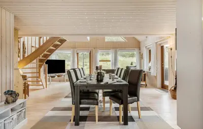 a dining room with a table and chairs at Gorgeous Home In Blokhus With Sauna in Blokhus