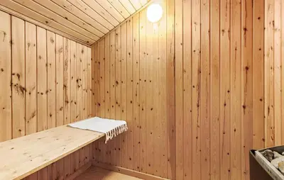 a wooden sauna with a bench in it at Pet Friendly Home In Thisted With Sauna in Thisted