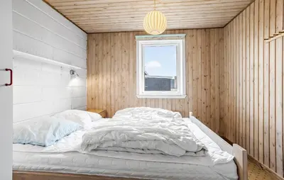 a bed in a room with a window at Beautiful Home In Thisted in Thisted