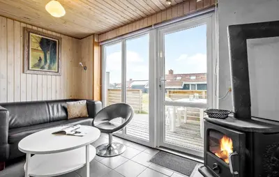 a living room with a couch and a fireplace at Beautiful Home In Thisted in Thisted