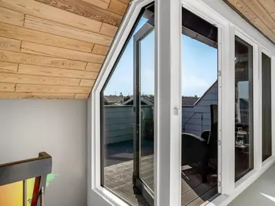 a room with sliding glass doors on a balcony at Holiday Home Isabel - 600m from the sea by Interhome in Blokhus