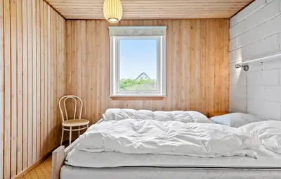 a bedroom with a bed and a window at 2 Bedroom Cozy Home In Thisted in Thisted