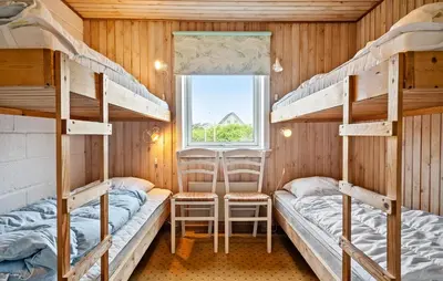 a bunk bed room with two bunk beds and a window at 2 Bedroom Cozy Home In Thisted in Thisted