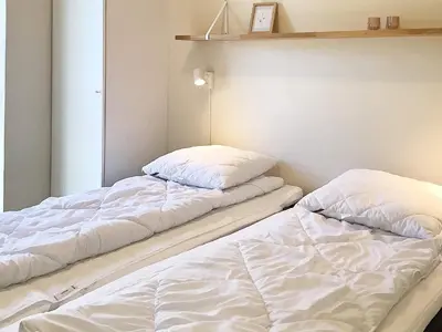 two beds sitting next to each other in a room at 5 star holiday home in Vestervig-By Traum in Vestervig
