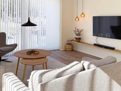 a living room with a couch and a table at 5 star holiday home in Vestervig-By Traum in Vestervig