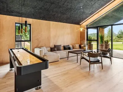 a living room with a pool table and a couch at 5 star holiday home in Skals in Skals