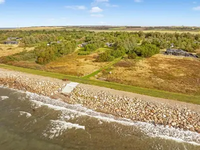an aerial view of the shoreline of a river at Holiday Home Skrollan - 200m to the fjord by Interhome in Sindrup
