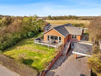 an overhead view of a house with a solarium at Large Holiday Home With A View Of The Fjord in Thyholm