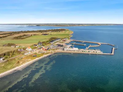 an aerial view of a harbor in the water at Large Holiday Home With A View Of The Fjord in Thyholm