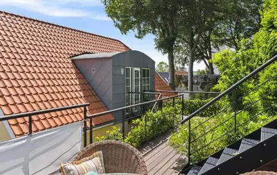a view of a house from the stairs of a house at Amazing Home In Hurup Thy in Doverodde