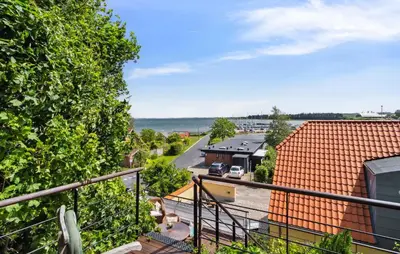an apartment balcony with a view of the water at Amazing Home In Hurup Thy in Doverodde