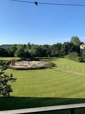 a view of a park with a large grass field at Stor og Lys Lejlighed i Hjertet af Holstebro in Holstebro