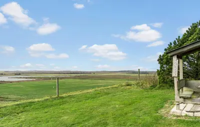 a view of a field from a house at Cozy Home In Hanstholm With Wifi in Hanstholm
