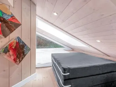 a room with a bed in a tiny house at Holiday Home Næwe - 10m to the fjord by Interhome in Roslev