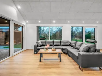 a living room with a couch and a table at Holiday Home Grimar - 400m to the fjord by Interhome in Vemb