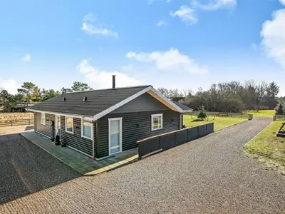 a small house on a gravel road at Holiday Home Elisaveta - 400m to the fjord by Interhome in Vemb