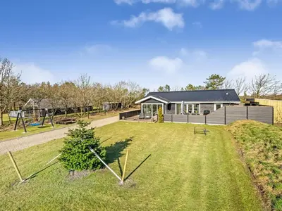 a house with a large yard in front of it at Holiday Home Elisaveta - 400m to the fjord by Interhome in Vemb