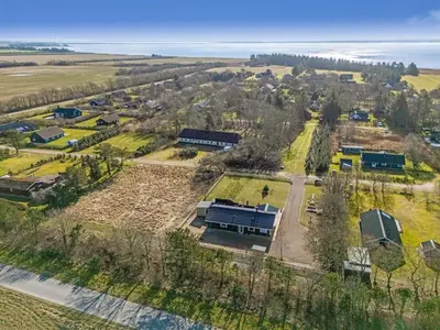 an aerial view of a school campus with the ocean in the background at Holiday Home Elisaveta - 400m to the fjord by Interhome in Vemb