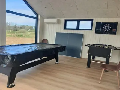 a ping pong room with a ping pong table at Holiday Home Stenkil - 1-2km from the sea by Interhome in Løkken