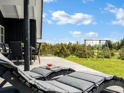 a patio with a fire pit on a house at Holiday Home Ljupco - 950m from the sea by Interhome in Saltum