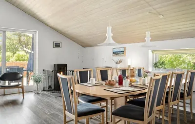 a dining room with a table and chairs at Beautiful Home In Vestervig With Sauna in Vestervig