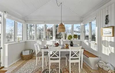 a white dining room with a white table and chairs at 3 Bedroom Cozy Home In Nibe in Nibe