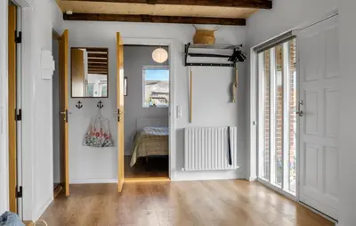 a hallway with a door leading to a bedroom at Amazing Home In Lemvig in Lemvig