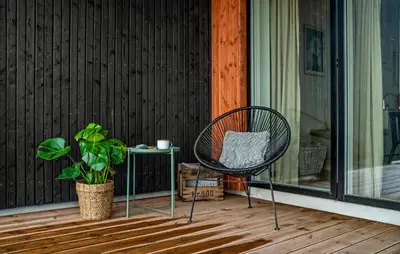 a chair sitting on a porch with a plant at Amazing Home In Thisted With Wifi in Thisted