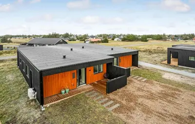 an orange and black house with a black roof at Amazing Home In Thisted With Wifi in Thisted