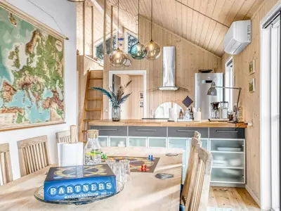 a kitchen with a table and a counter top at Holiday Home Carlina - 700m to the fjord by Interhome in Løgsted