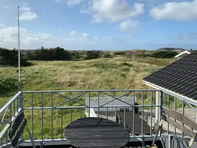 a metal ramp with a bench and a field at Home With Sauna Near Klitmøller in Thisted