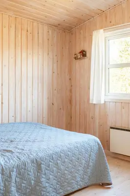a bedroom with a bed and a window at North Jutland Nature Near Thorup Beach in Fjerritslev