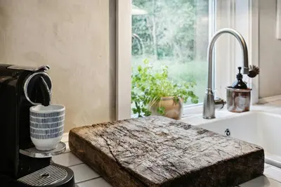 a kitchen counter with a coffee maker and a window at Nature-Close Home Near Beach At Limfjorden in Thyholm