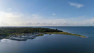 an island in the middle of a large body of water at Panoramic View And Terrace In Charming Home in Højslev