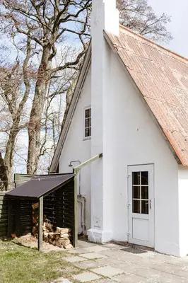 an old white church with a white door at Small House With View Of The Limfjord in Roslev
