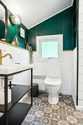 a bathroom with a toilet and a sink at Warm Colors And Beautiful Outdoors In Thy in Sønder Ydby