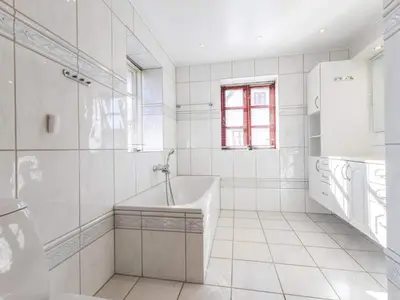 a white bathroom with a tub and a sink at Charming Retreat in Blokhus - By Traum Ferienwohnungen in Blokhus