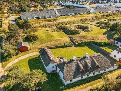 an overhead view of an old farm house with a grass roof at Charming Retreat in Blokhus - By Traum Ferienwohnungen in Blokhus