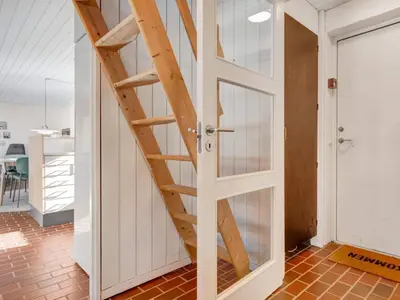 a door leading to a room with a staircase at Charming Retreat in Rodhus - By Traum Ferienwohnungen in Pandrup