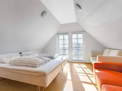 a white room with a bed and a window at Charming Retreat in Blokhus - By Traum Ferienwohnungen in Blokhus