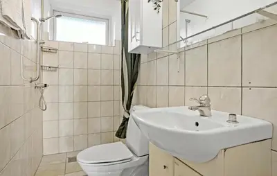 a white bathroom with a sink and a toilet at 2 Bedroom Nice Home In Roslev in Roslev