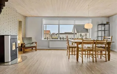 a kitchen and dining room with a table and chairs at 4 Bedroom Awesome Home In Thisted in Thisted