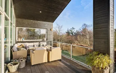 a patio with a table and chairs on a deck at Gorgeous Home In Nibe With Wifi in Nibe