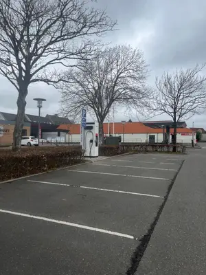 an empty parking lot with trees and a building at Perfect space for you and your colleague in Vinderup