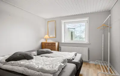 a bedroom with a bed with two pillows on it at Awesome Home In Øster Assels With Wifi in Øster Assels